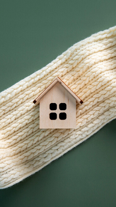 wooden home with a scarf under it